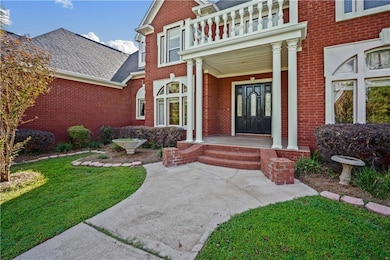 View of exterior entry featuring a balcony and a l