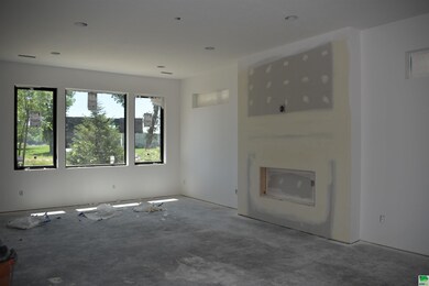 Living room with electric fireplace and stone surround
