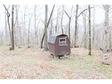 Exterior Front. Detached bathroom with hot water s