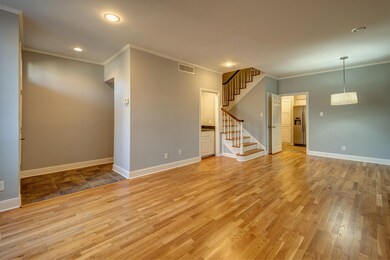 A bright, open living space with polished wood flo