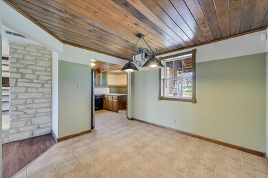Unfurnished dining area featuring light tile patt