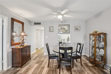 Dining space with light LVP flooring and ceiling fan
