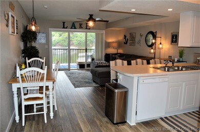 Open floor plan with tons of updates and large lak
