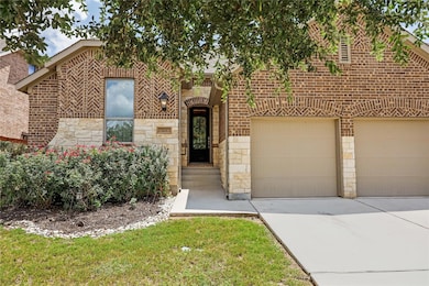 View of front of property featuring concrete driv