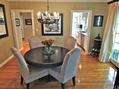 French doors opens to side patio with fountain