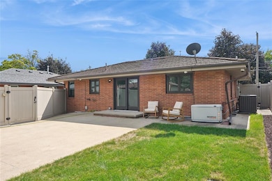 Sliders walk out to large patio perfect for entertaining