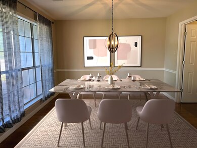 This room has been virtually staged. Dining area w