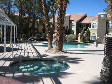 Community pool featuring a community hot tub and a