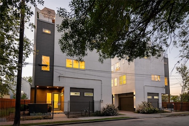 Modern townhouse exterior featuring a spacious dou