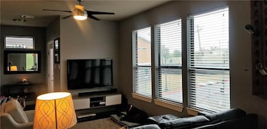 Living area with plenty of natural light and a ce