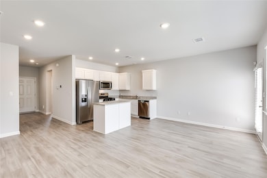 Kitchen with visible vents, recessed lighting, a 