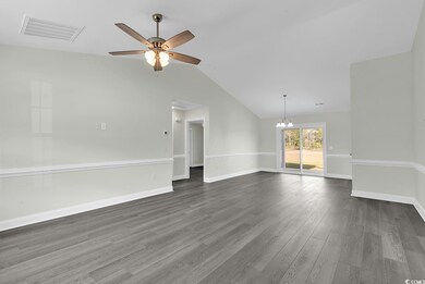 Unfurnished room with ceiling fan with notable cha