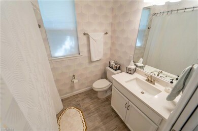 Bathroom featuring hardwood / wood-style floors, v
