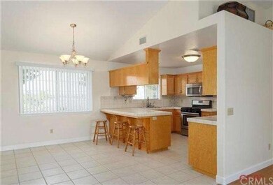 The kitchen has plenty of storage, stainless steel