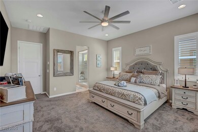 Bedroom with a ceiling fan, baseboards, recessed l