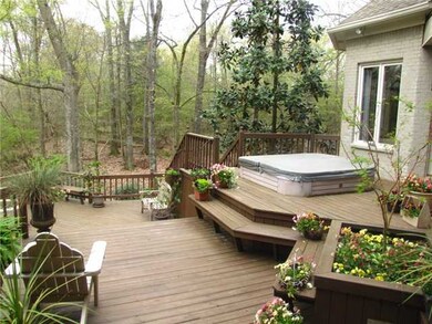 Relax in the buitl-in hot tub on the huge back dec
