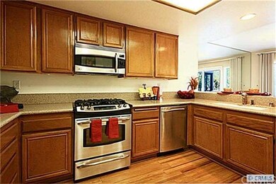 UPGRADED GOURMET KITCHEN OPEN TO DINING ROOM W/ VI