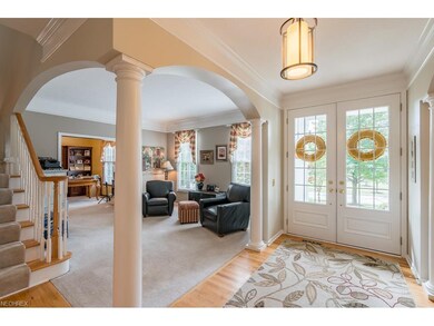 Impressive moldings, columns, and arched entryways