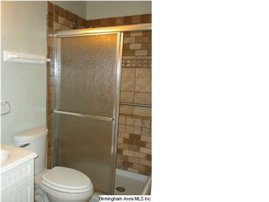 Large double ceramic tile shower and floors.