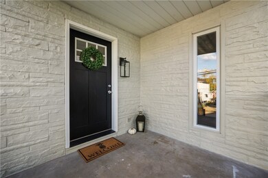 Beautiful brand new door with covered porch is the