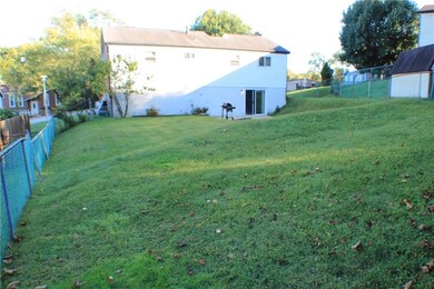 Back of House and Large Fenced-in Grass Back Yard!