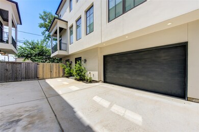 Modern townhouse exterior featuring a two-car gara