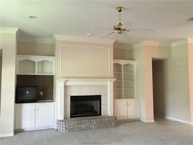 Living area with wood burning fireplace, gas logs