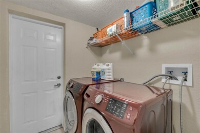 Laundry Room with door to attached garage.
