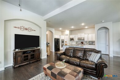 Open to kitchen and dinning areas