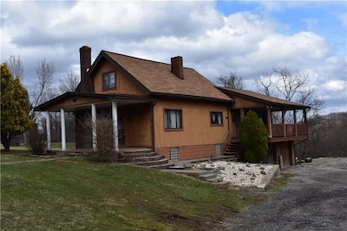 Home has a deck and a large 2 car garage with work