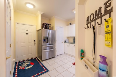 Kitchen featuring light tile patterned flooring, c