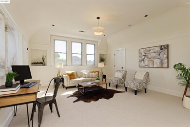 Carpeted living area with vaulted ceiling and an office area