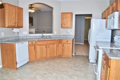 View of kitchen through to the den.