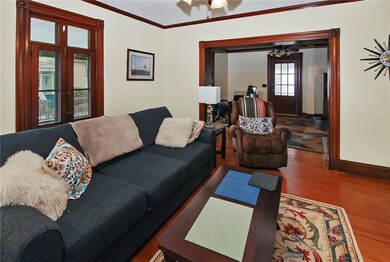 Living Rom is open to adjacent room currently used