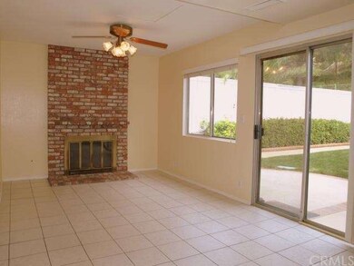 Kitchen opens to Family Room with Fireplace