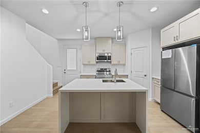 Spare room featuring ceiling fan, light wood-type flooring, recessed lighting, and baseboards
