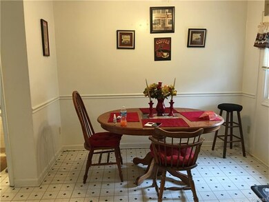 Eating area is directly across from kitchen.