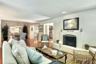Living room with view of open layout.