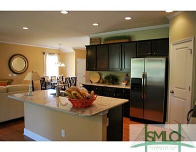 Kitchen. The island has a spacious breakfast bar.