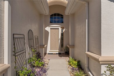 The entry features a newer storm door. Blooming co