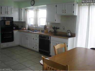 Kitchen has a double oven and dishwasher. Ceramic Tile Floor. Refrigerator Stays.