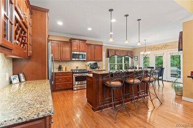 Kitchen featuring decorative light fixtures, backs