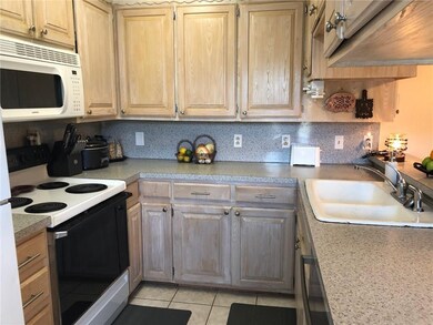 Kitchen has lots of cabinets and counter top space