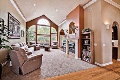 Beautiful archways and designer windows. Gorgeous hardwood floors. Dramatic fireplace mantal.