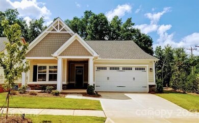 Covered front porch, 2 car garage, corner lot, lawn maintenance, sidewalks....Great location in Mint Hill.