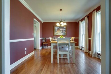 Beautiful Dining Room w/Hardwood and accent trim work &Crown