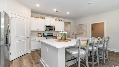 Kitchen with appliances with stainless steel finis