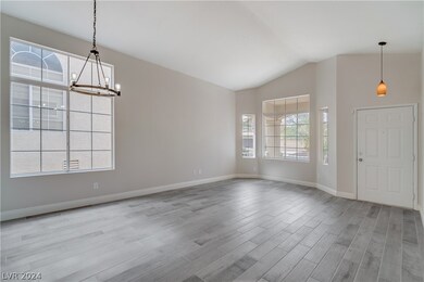 Large living room as you enter home with large win
