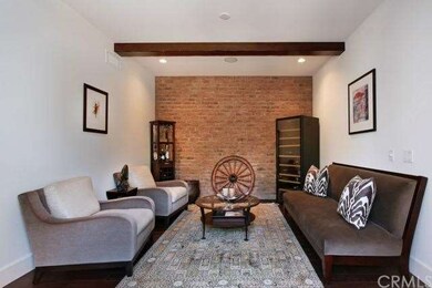 Framed with a warm brick wall, this versatile room