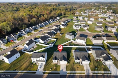 Aerial view of property's location with nearby suburban area